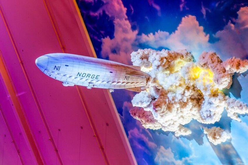 A vintage airplane labeled "Norge" flying with a colorful explosion behind it. 4