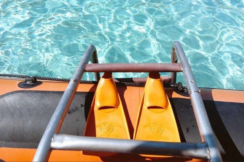 A boat with orange seats and a metal railing. 3