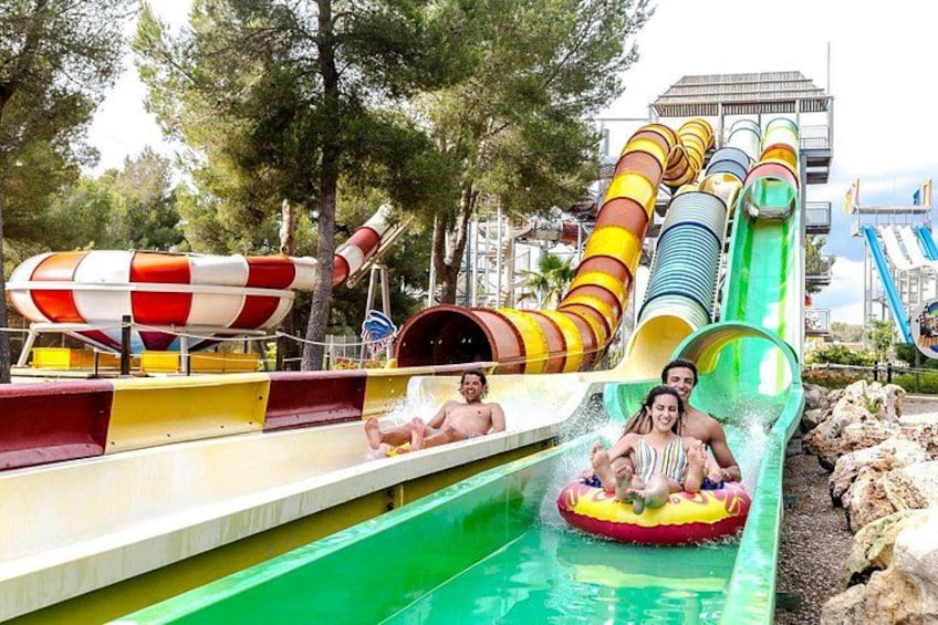 A water park with multiple slides and a pool. 3