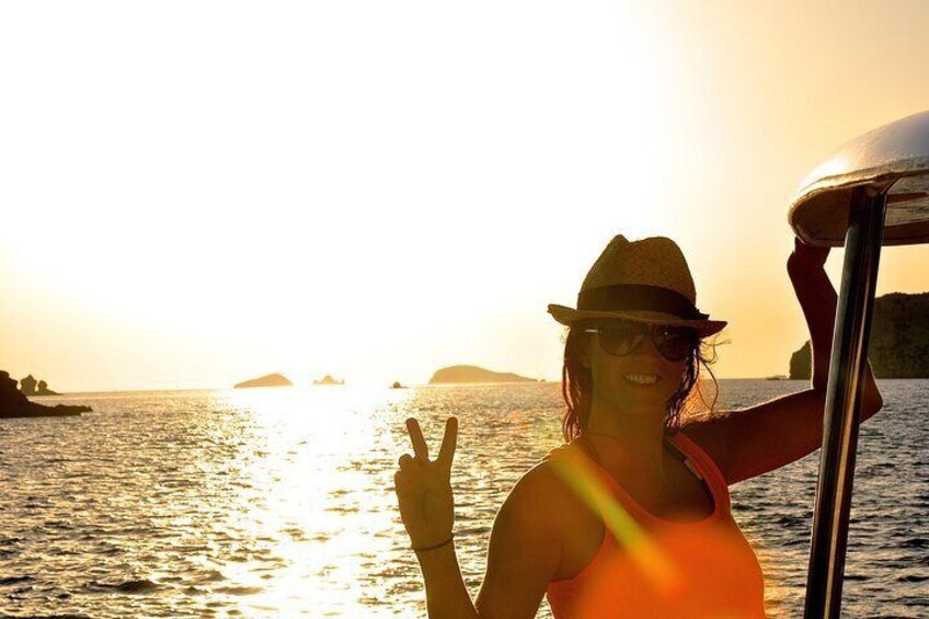 A customer enjoying the Sunset in front of Café del Mar