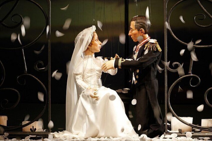 A wedding scene with a bride in a white dress and a groom in a military uniform. 4