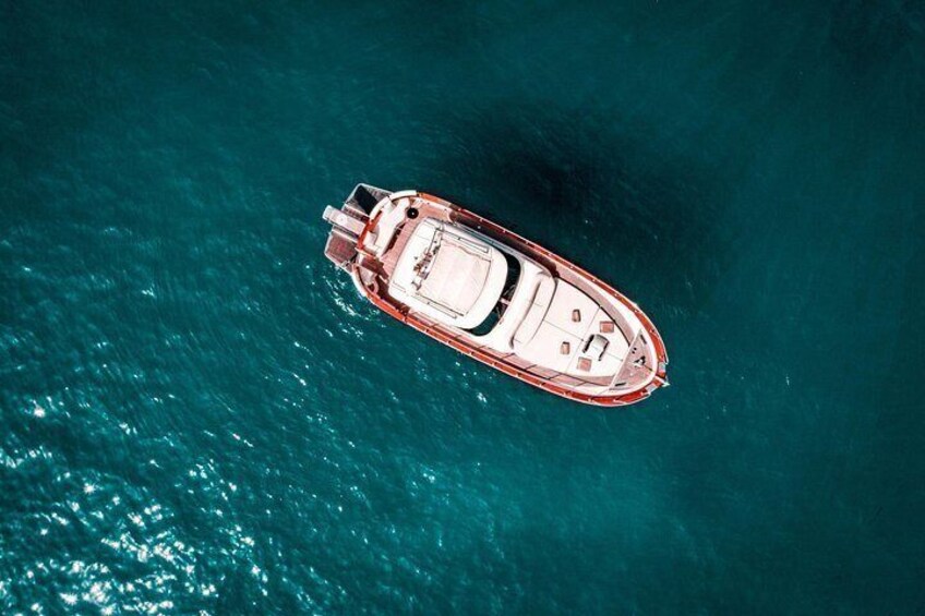A small boat on turquoise water. 3