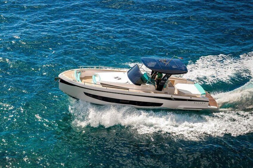 A speedboat on a clear blue sea. 5