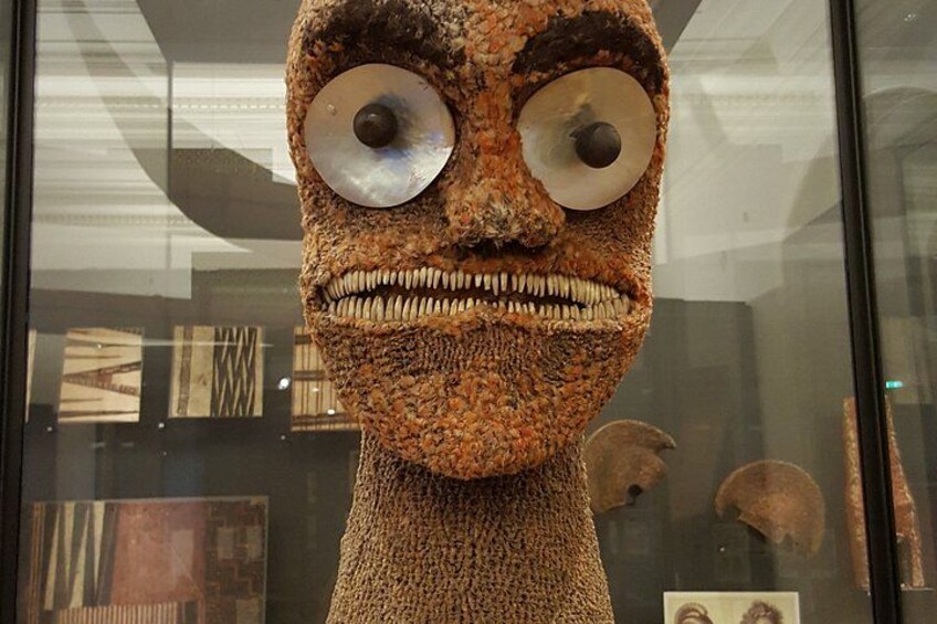 A textured sculpture with large eyes and a wide mouth. 5