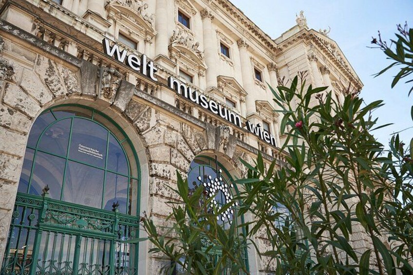 A historic building with a sign reading 'welt museum Wien'. 4