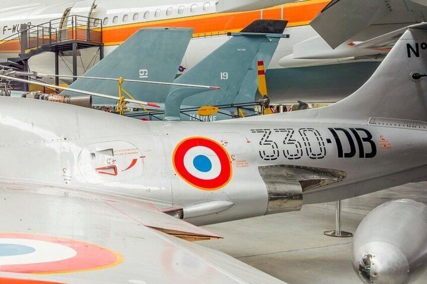 A vintage military aircraft with a roundel insignia and the number '330-DB' on its fuselage. 5
