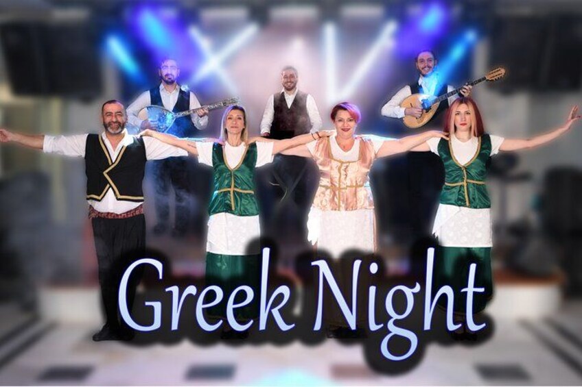 A group of people in traditional Greek attire with the text 'Greek Night' on a stage. 2
