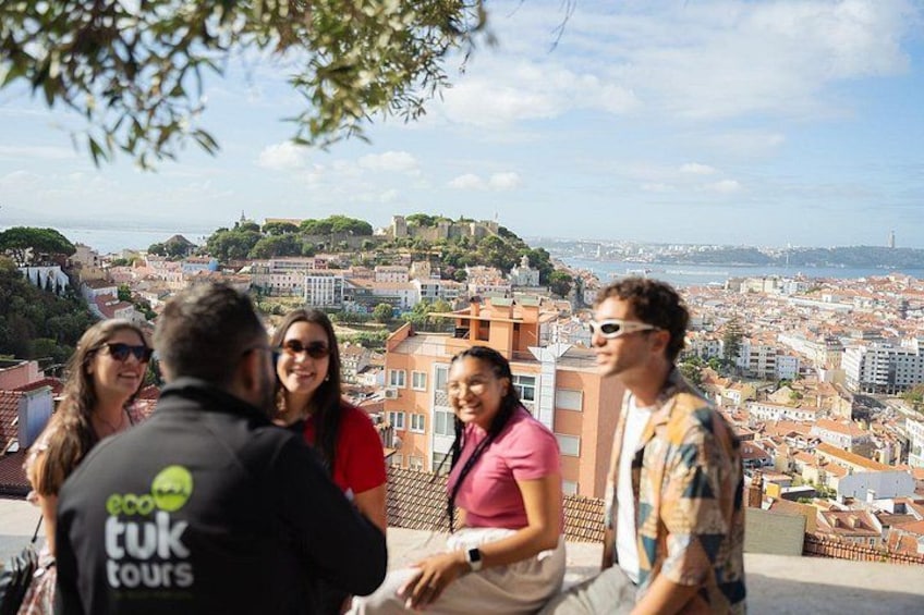 Tuk tuk guided tour in Lisbon. Stop at Graça viewpoint to enjoy the view over the castle and the river. 2