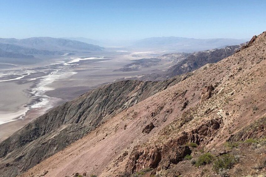 A mountainous landscape with a river flowing through a valley. 5