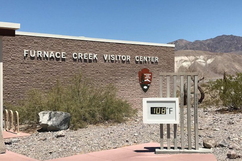 The Furnace Creek Visitor Center with a sign indicating 108°F temperature. 3