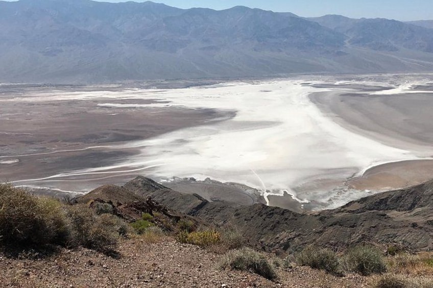 A vast salt flat with distant mountains. 4