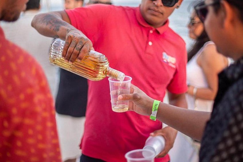 A person pouring a drink into a glass. 1