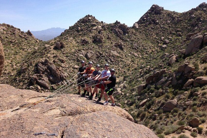 A group of people on a rocky mountain trail. 2