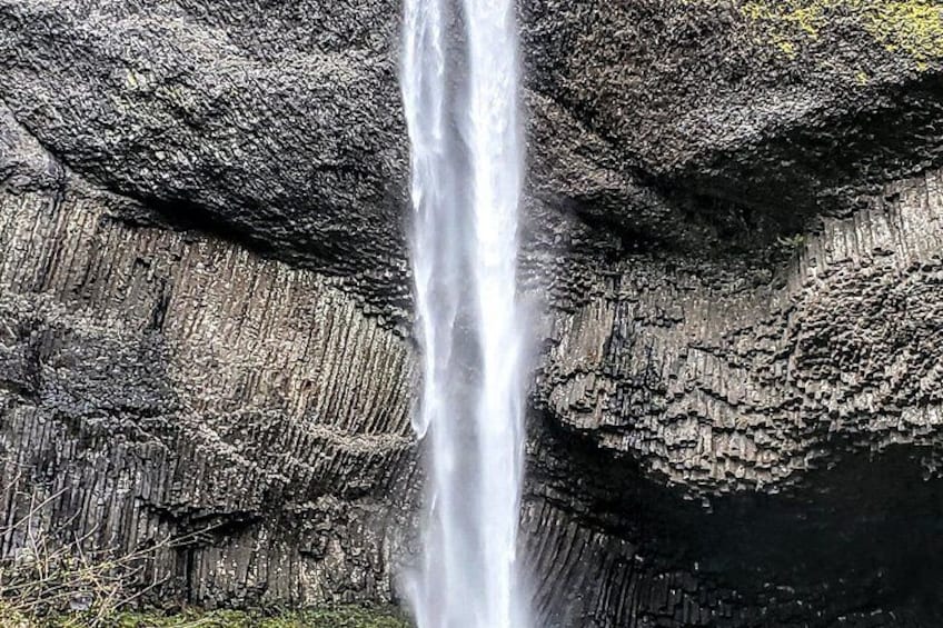 A waterfall cascading down a rocky cliff. 3