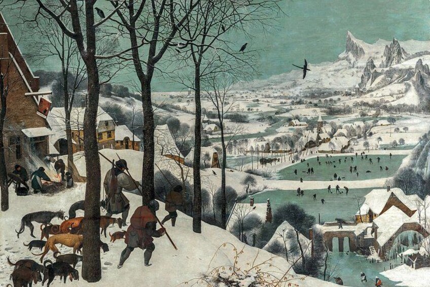 A snowy landscape with a village, a river, and mountains in the background. 3