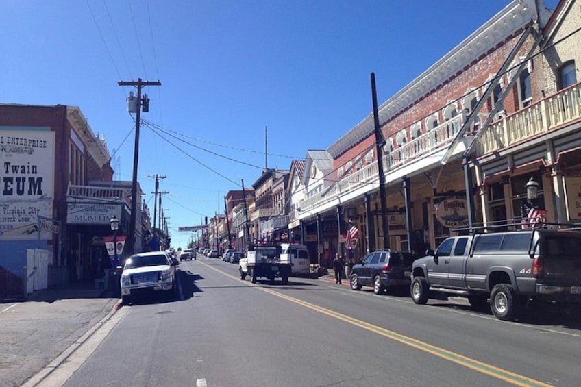 A street lined with buildings, including a theater and a museum. 2