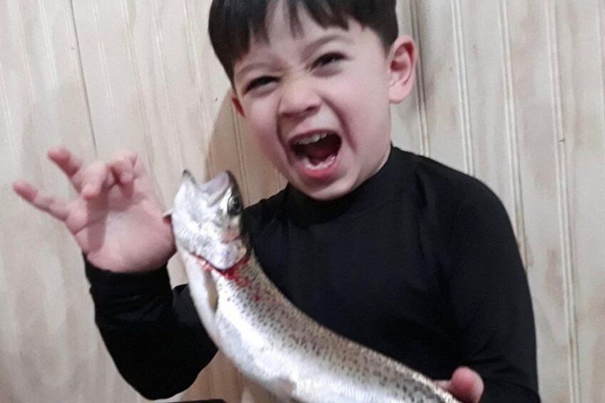 A person holding a fish. 2