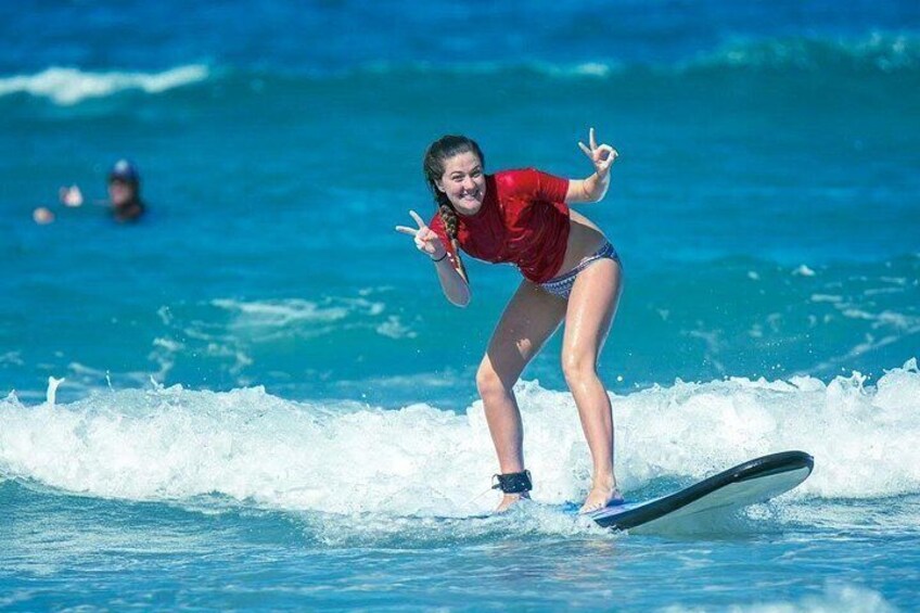 A person surfing on a wave in the ocean. 1