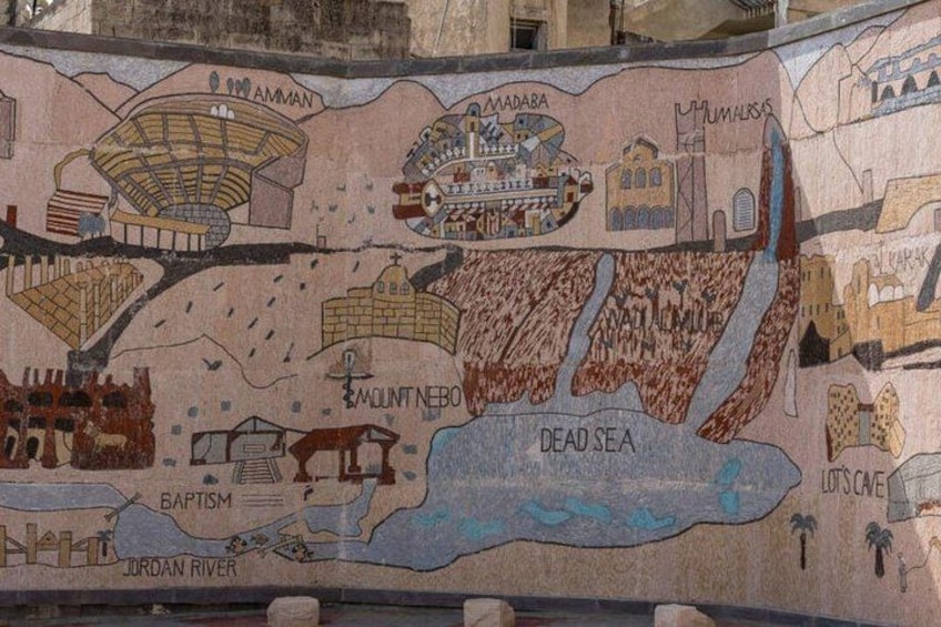 A detailed map mural with landmarks like Amman, Madaba, and Mount Nebo. 2