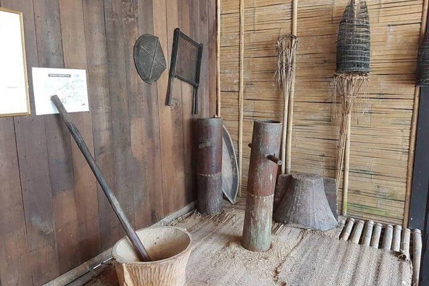 Traditional farming tools, a wooden wall, and a map on the wall. 5