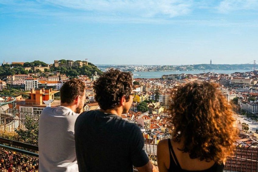 A cityscape with a hilltop view, a river, and a historic castle. 3