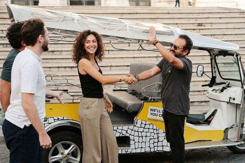 A yellow and white vehicle with a sign that reads 'WE'LL DO YOU A BOOSTROPORT.' 2