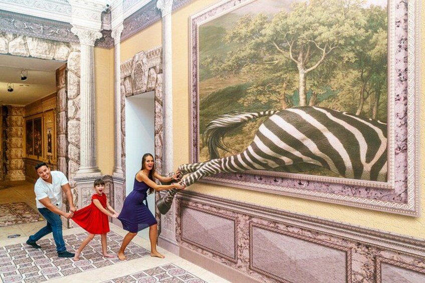 A family interacting with a large zebra painting in an ornate room with classical architecture. 2