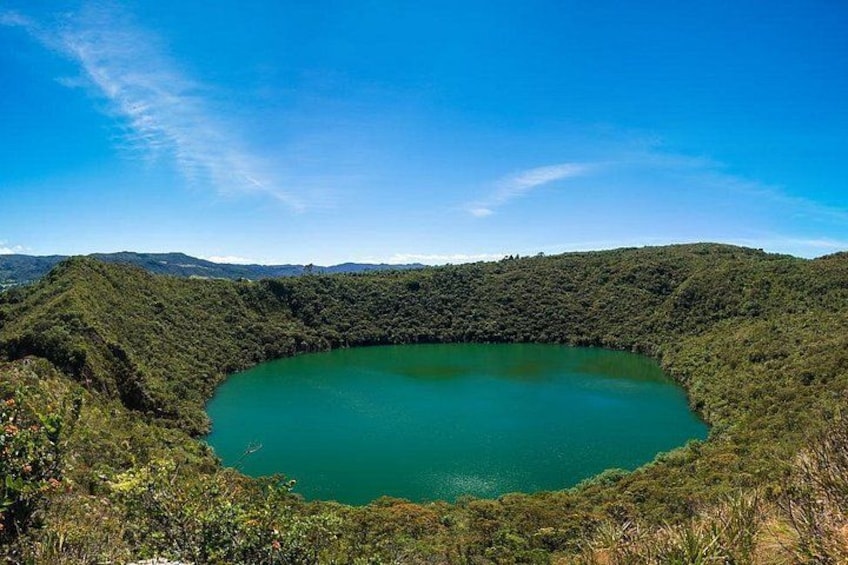 A large circular lake surrounded by dense forest. 1