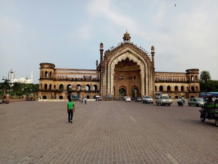 A large, ornate building with a central archway and multiple smaller arches. 3