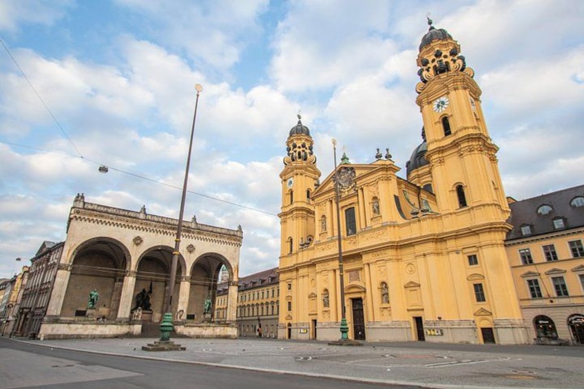 A historic building with two towers and a large archway. 3