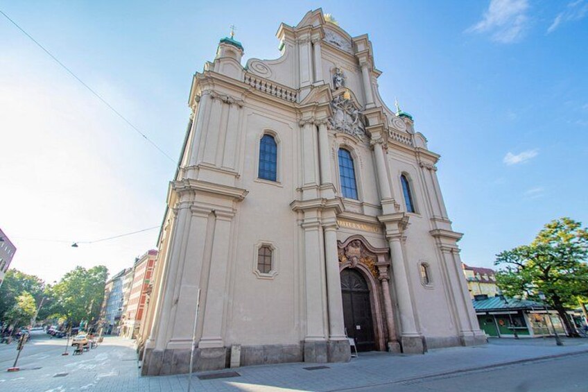 A large, ornate church with a clock tower and a dome. 4