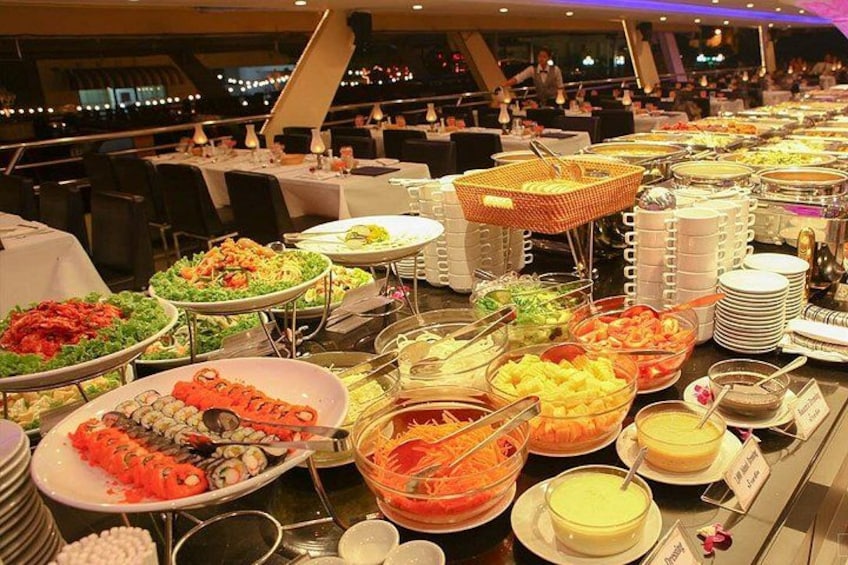 A buffet with various dishes including sushi, salads, and desserts. 4