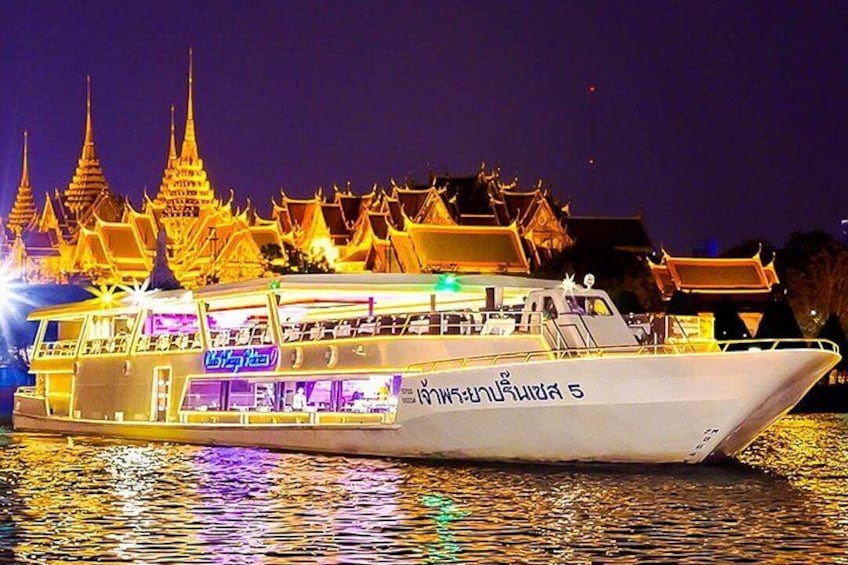 A boat with a traditional Thai temple in the background. 3