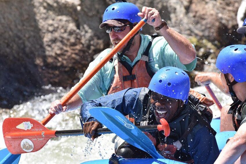 A group of people kayaking on a river. 4