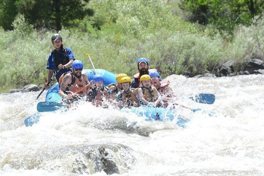 A group of people rafting on a river. 2