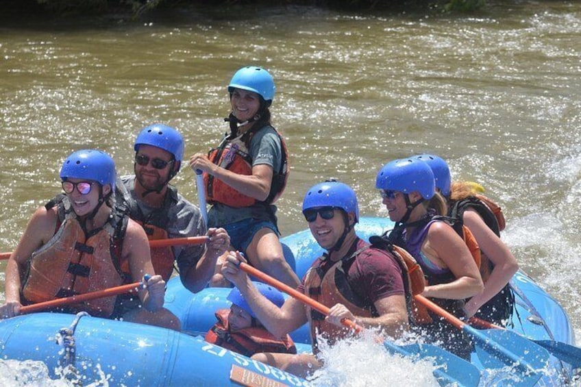 A group of people rafting on a river. 4