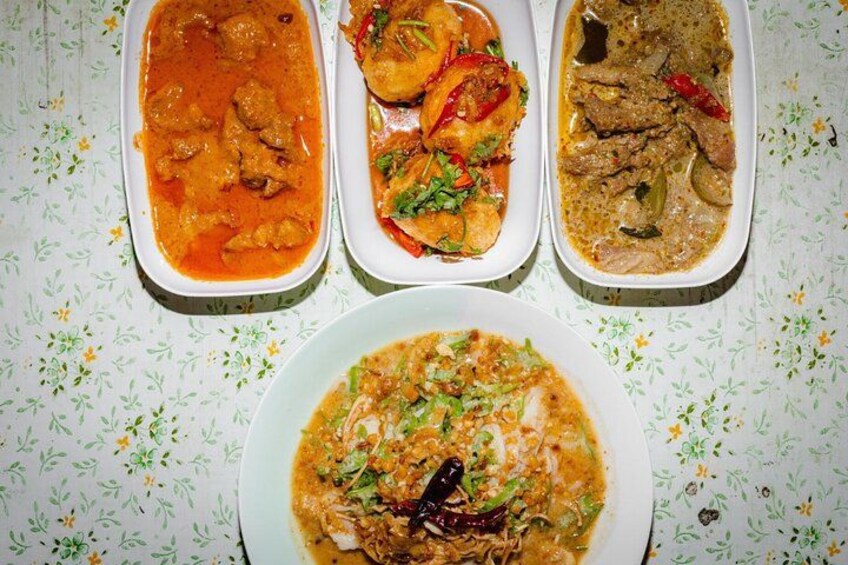 Three dishes of curry and a bowl of rice. 3