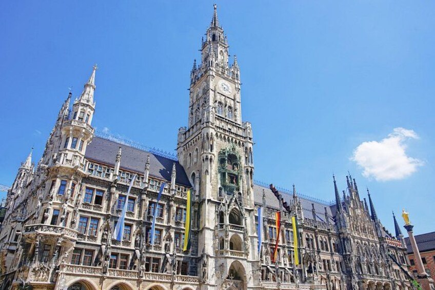A historic building with intricate architecture, including a prominent tower and multiple spires. 3