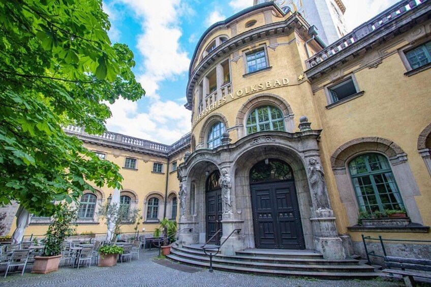 A historic building with arched windows and a central entrance. 3