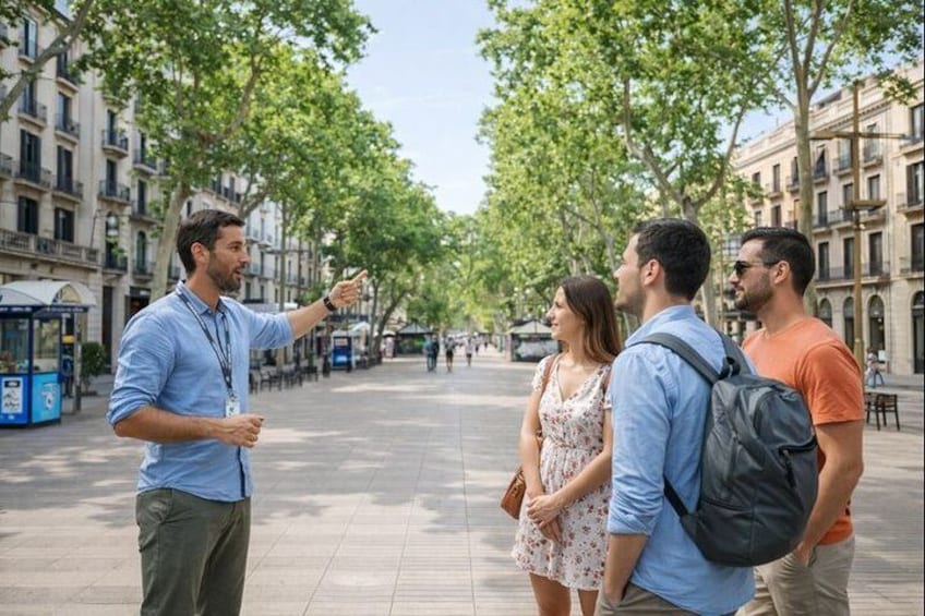 A man pointing towards the street, with a group of people standing nearby. 2