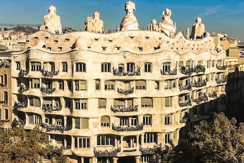 A building with unique architectural style, featuring balconies and decorative elements. 3