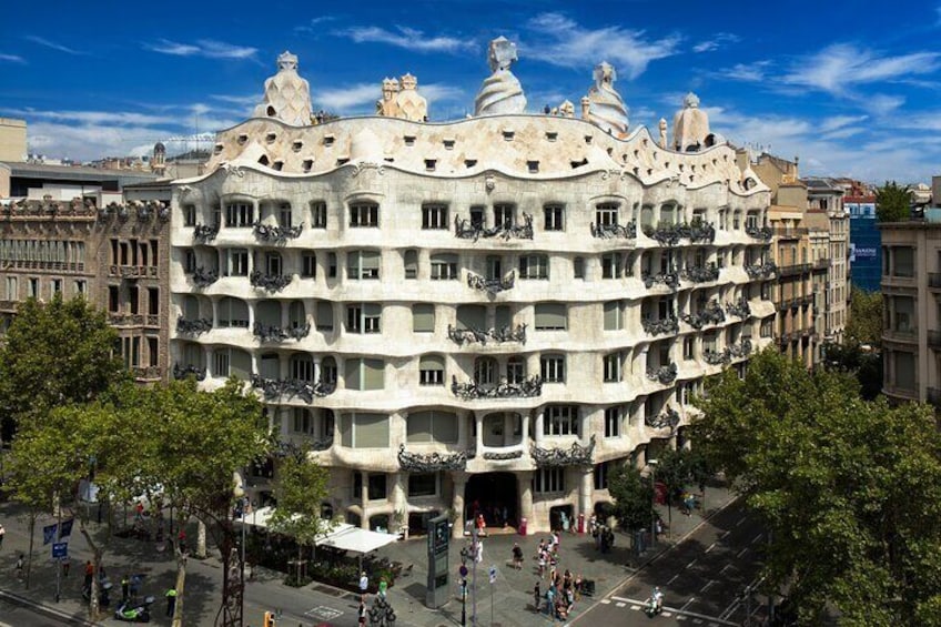A distinctive Art Nouveau building with balconies and decorative elements. 1