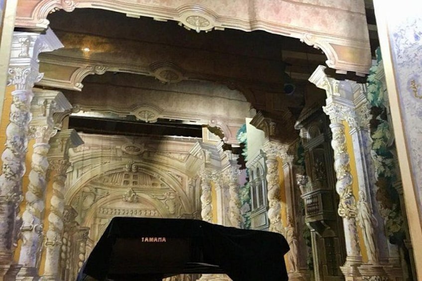 An ornate architectural interior with columns and intricate carvings. 5