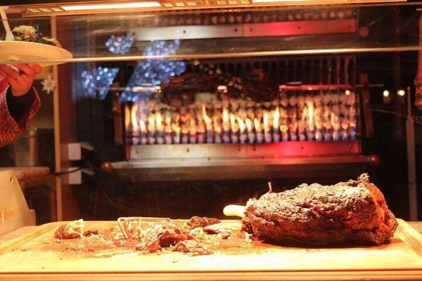 A dessert in a glass case with a lit interior, possibly a bakery or dessert shop. 3