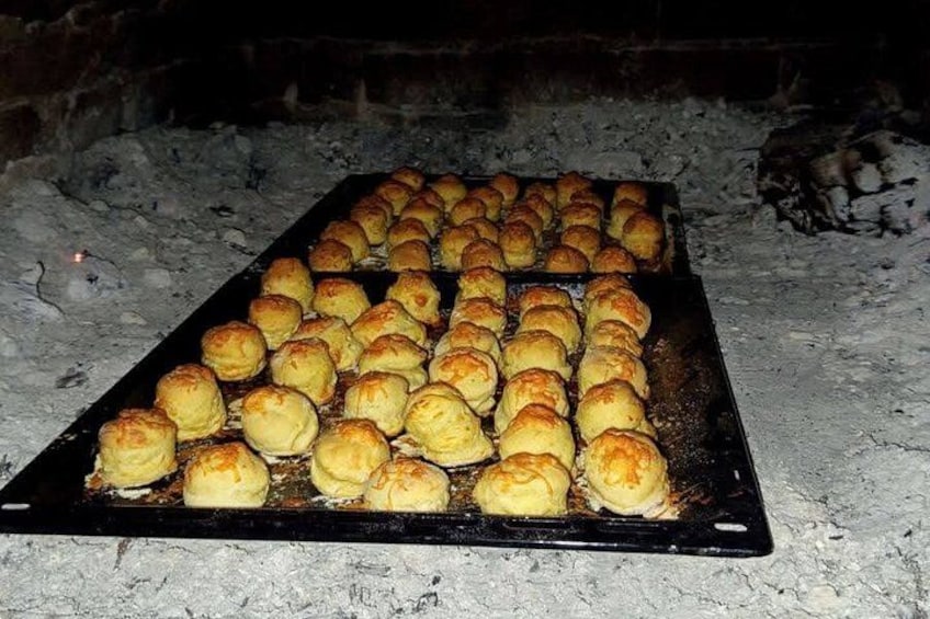 A tray of baked goods on a grill. 4