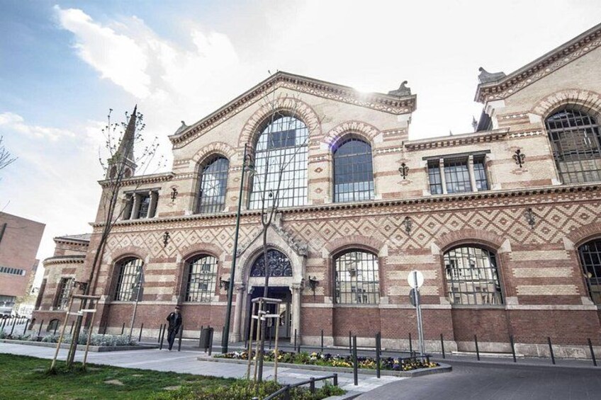 A historic building with arched windows and a brick facade. 3