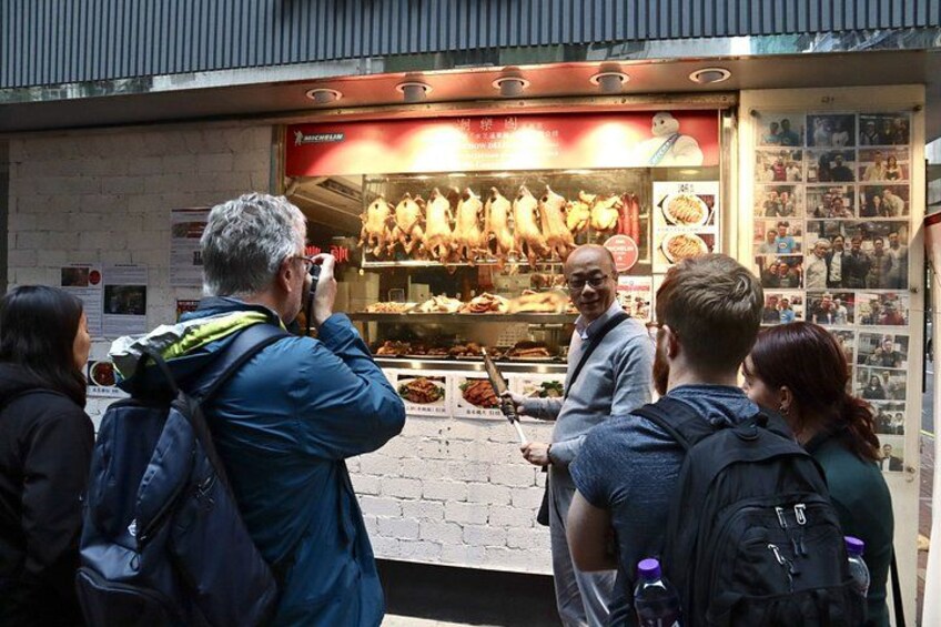 A food stall with roasted meats displayed. 3