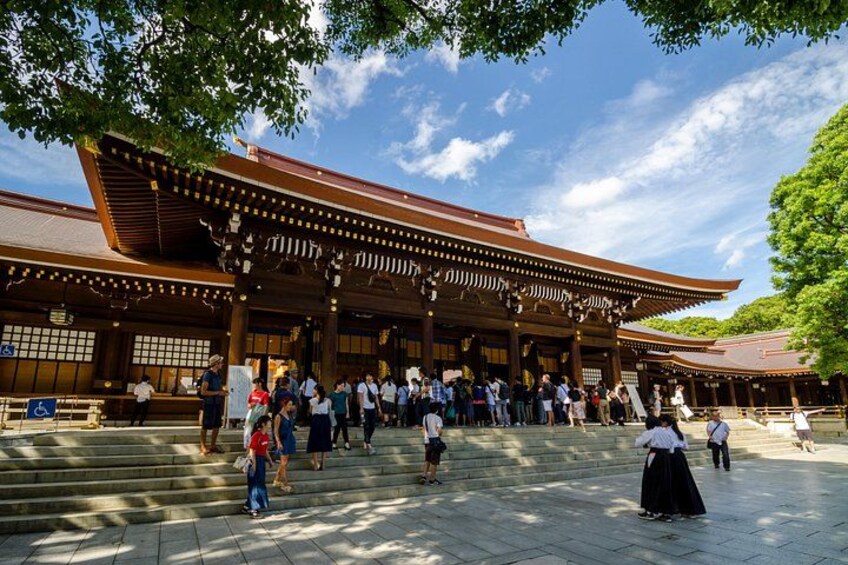 A traditional Japanese building with a wooden structure and a tiled entrance. 2