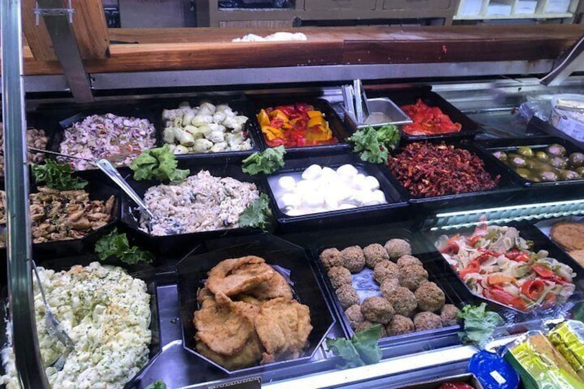 A variety of food items in a buffet setting. 2