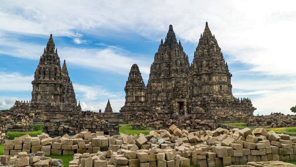 A temple complex with multiple tiered towers and ruins. 5